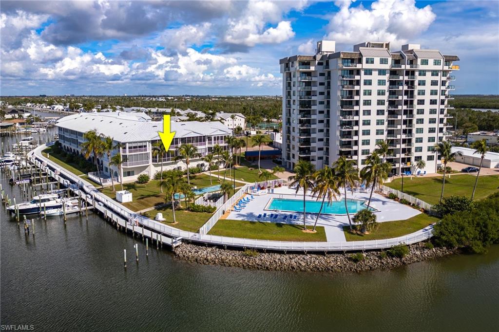 Bird's eye view of a pool and a large body of water