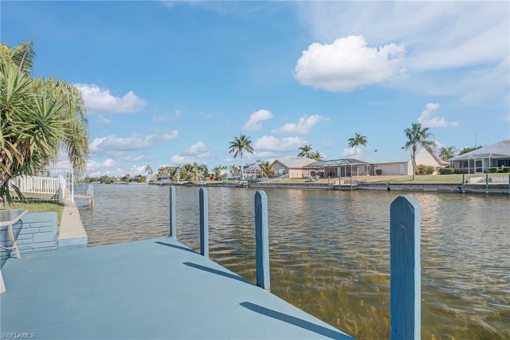 Dock featuring a water view and a residential view