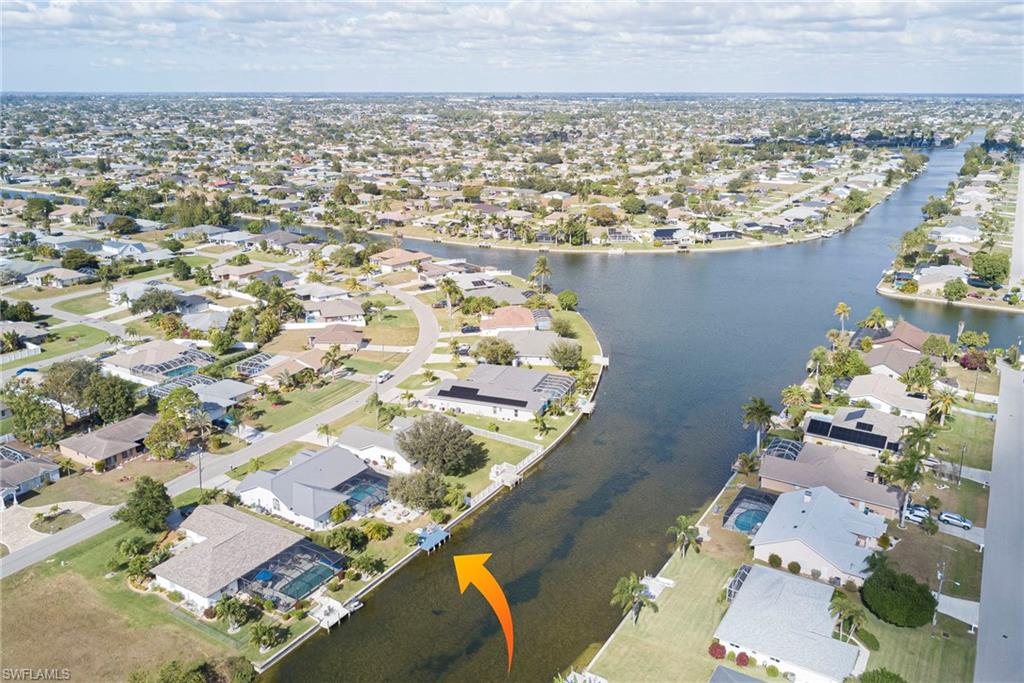View of property location with nearby suburban area and a large body of water