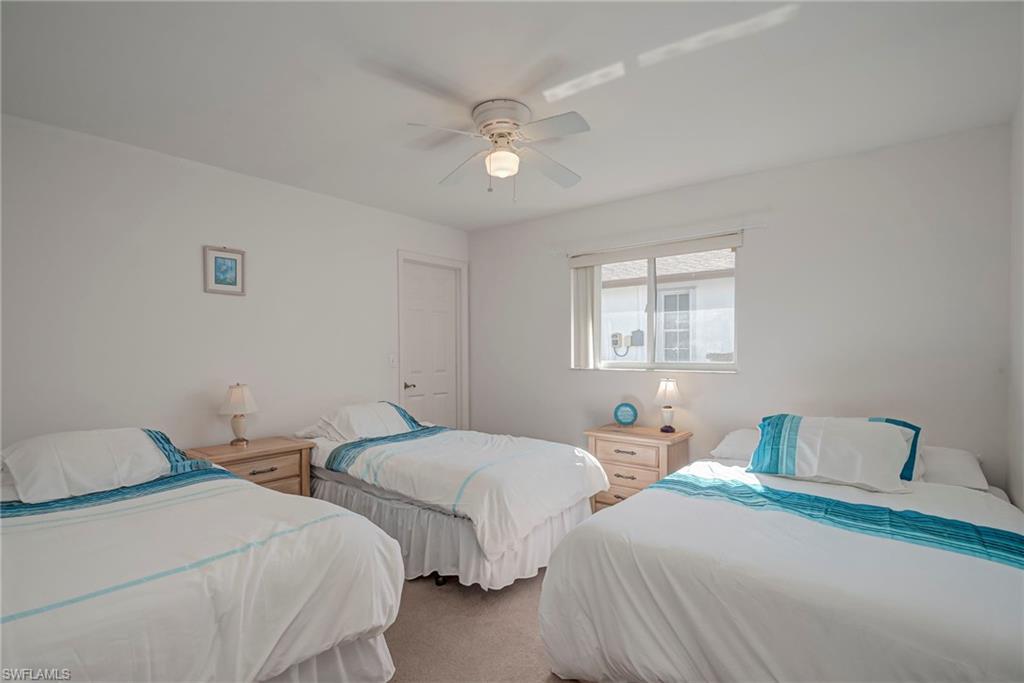 Bedroom featuring carpet floors and ceiling fan