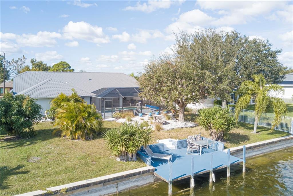 Dock with a yard, a patio area, a lanai, and a sunroom