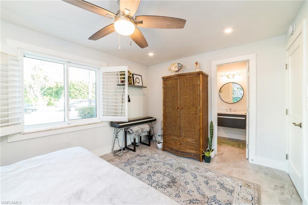 Bedroom featuring ceiling fan, ensuite bathroom, and recessed lighting
