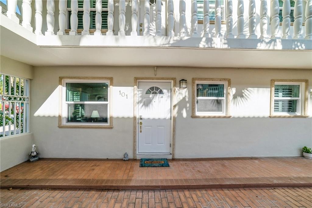 Property entrance with stucco siding
