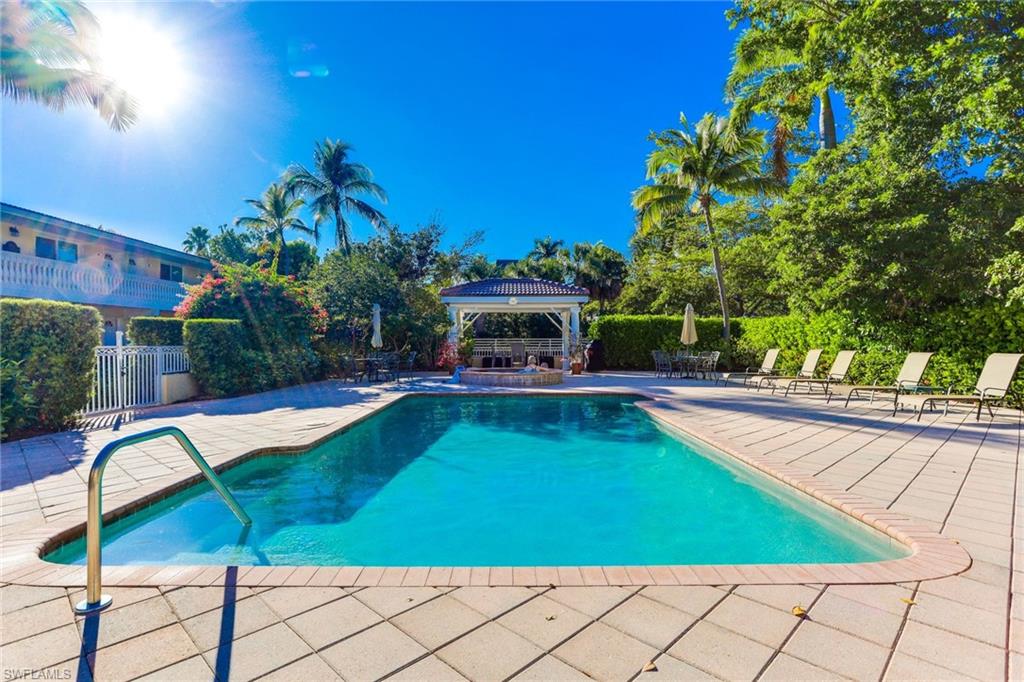 Swimming pool featuring a patio and a gazebo