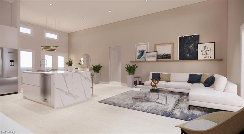 Living area featuring recessed lighting and a towering ceiling