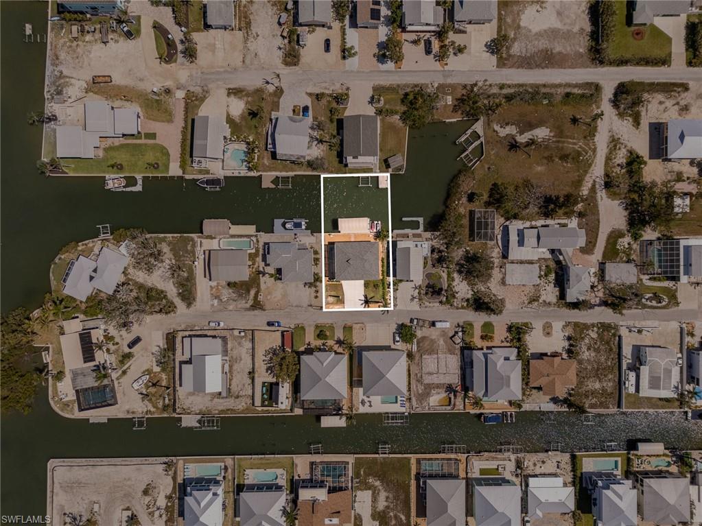 View of property location with nearby suburban area