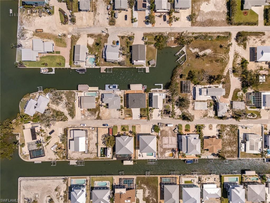 Aerial overview of property's location featuring nearby suburban area