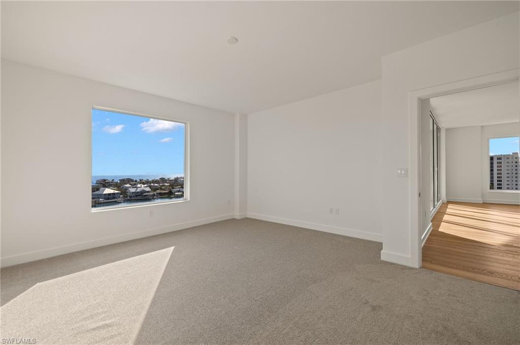 Master suite features light carpet and plenty of natural light