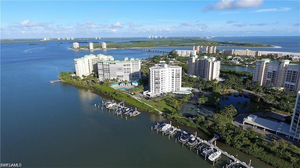 Aerial view highlighting the building’s prime waterfront setting and proximity to the beach.