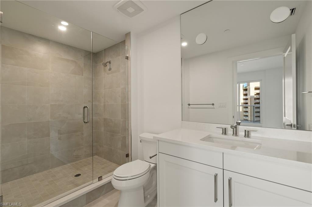Bathroom 2 with vanity, a stall shower, and recessed lighting