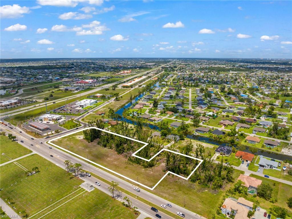 Traffic from new Daybreak Market & Gas, US Post Office and more must go by this property, as businesses fronting Pine Island must enter from behind on the road that goes by this site.