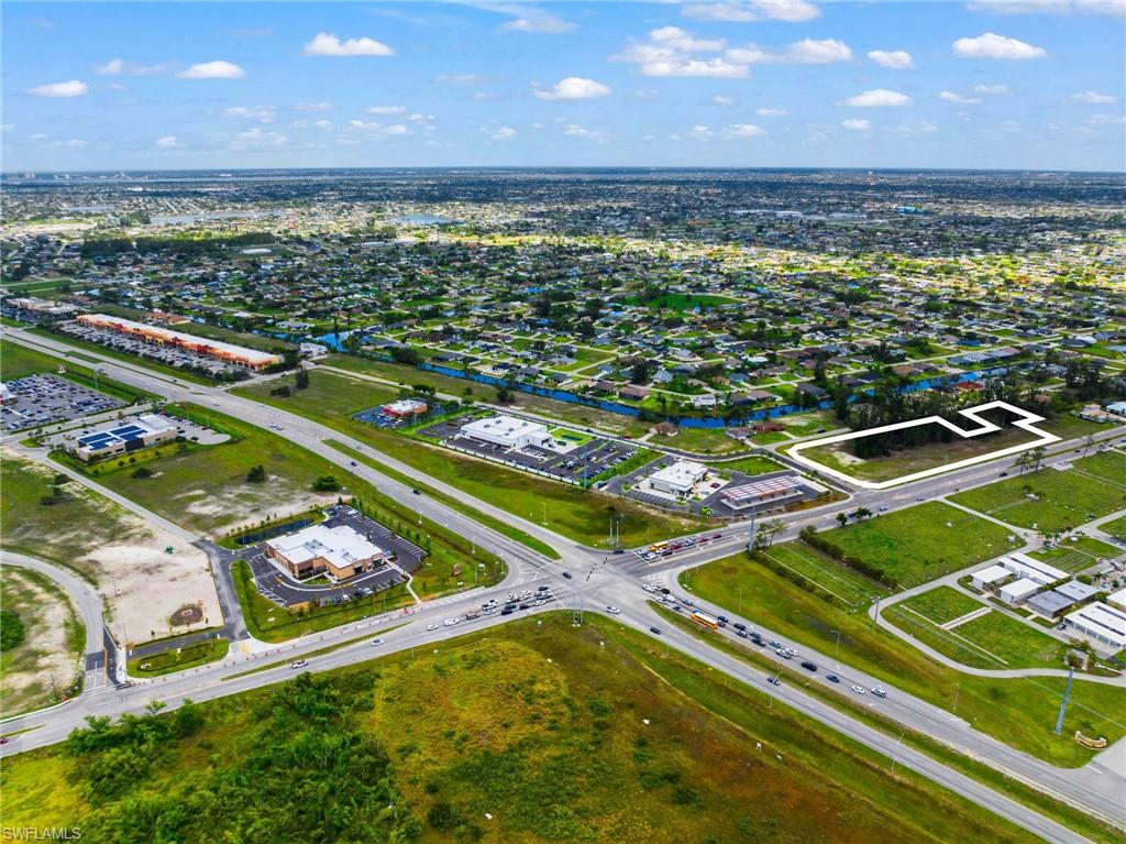 Traffic from new Daybreak Market & Gas, US Post Office and more must go by this property, as businesses fronting Pine Island must enter from behind on the road that goes by this site.