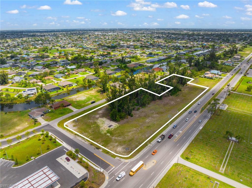 Traffic from new Daybreak Market & Gas, US Post Office and more must go by this property, as businesses fronting Pine Island must enter from behind on the road that goes by this site.
