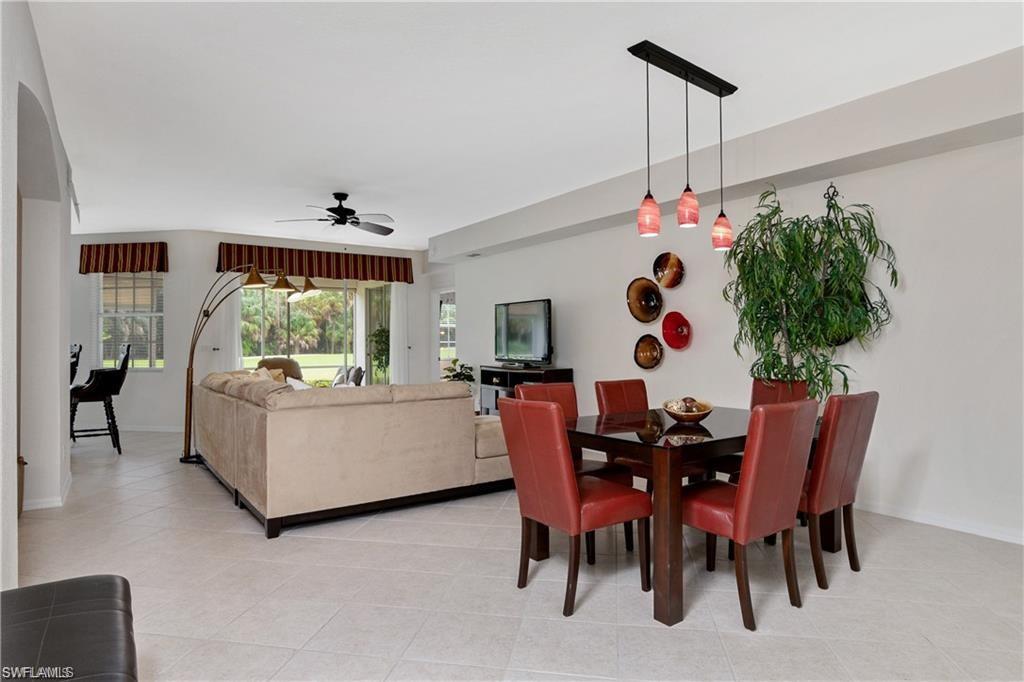 Dining room with a ceiling fan and light tile patterned floors