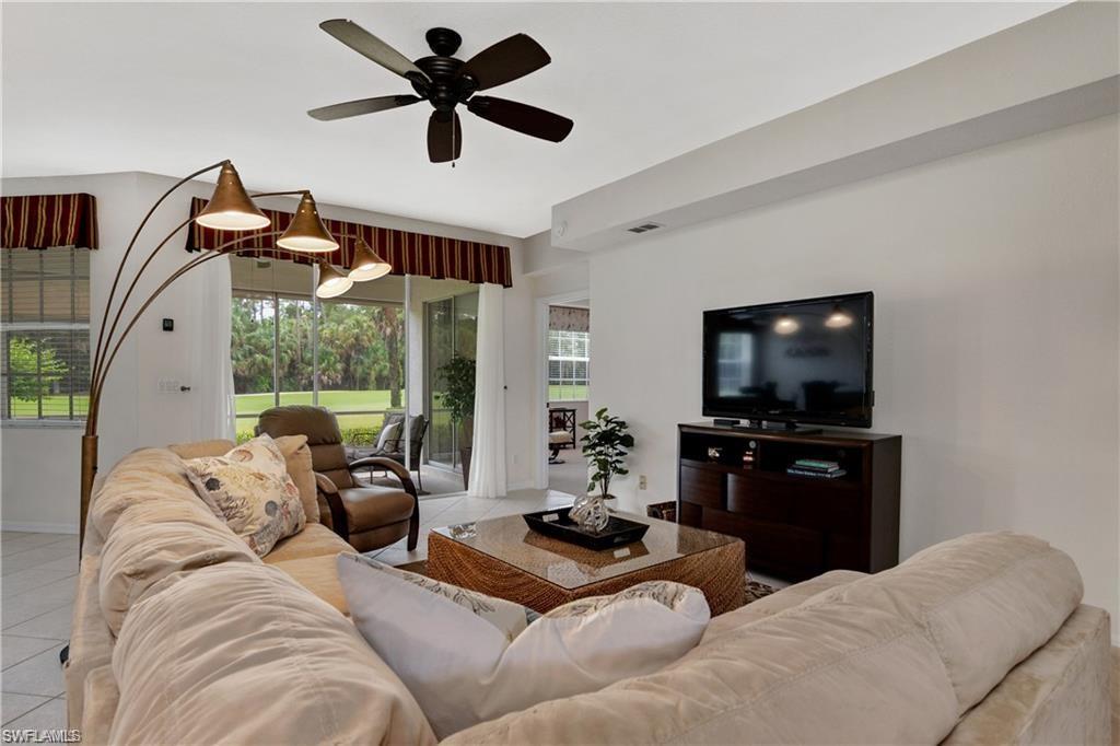 Tiled living area with a ceiling fan