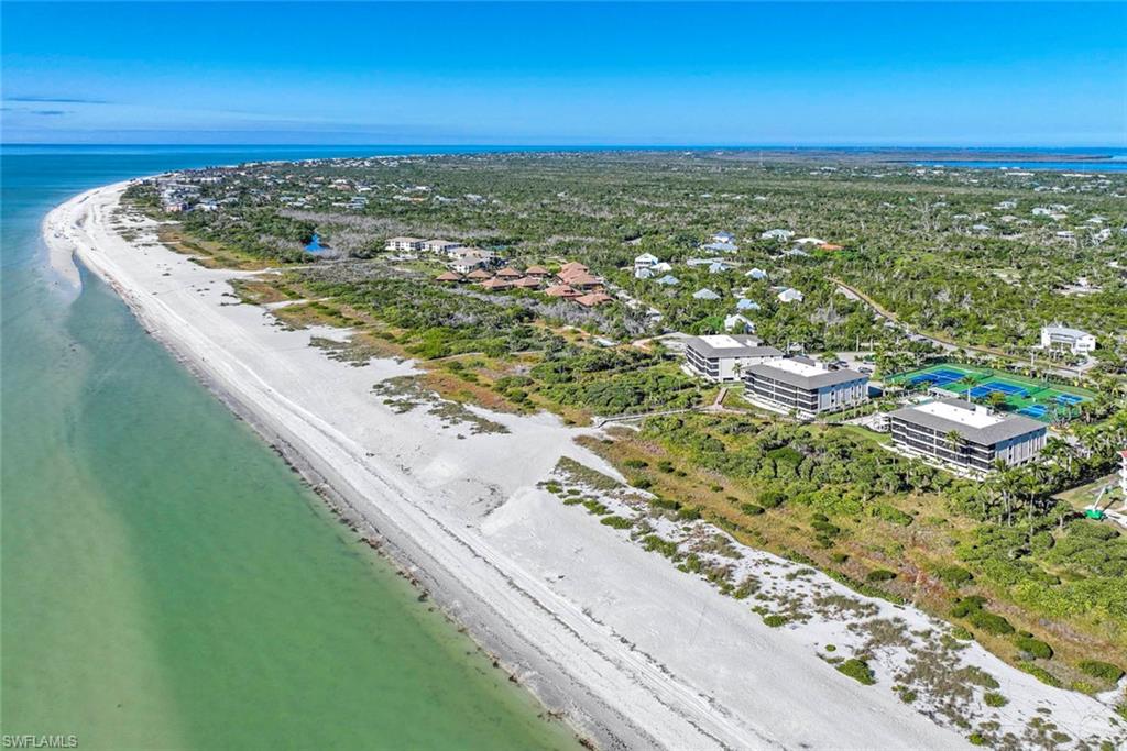 Aerial view of waterfront with a beach
