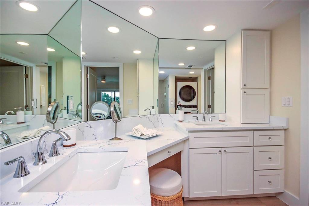 Bathroom featuring double vanity and recessed lighting
