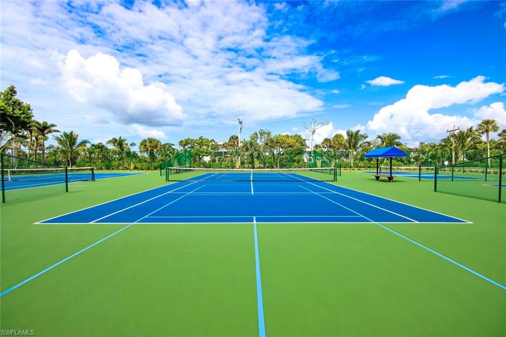 View of tennis court with community basketball court