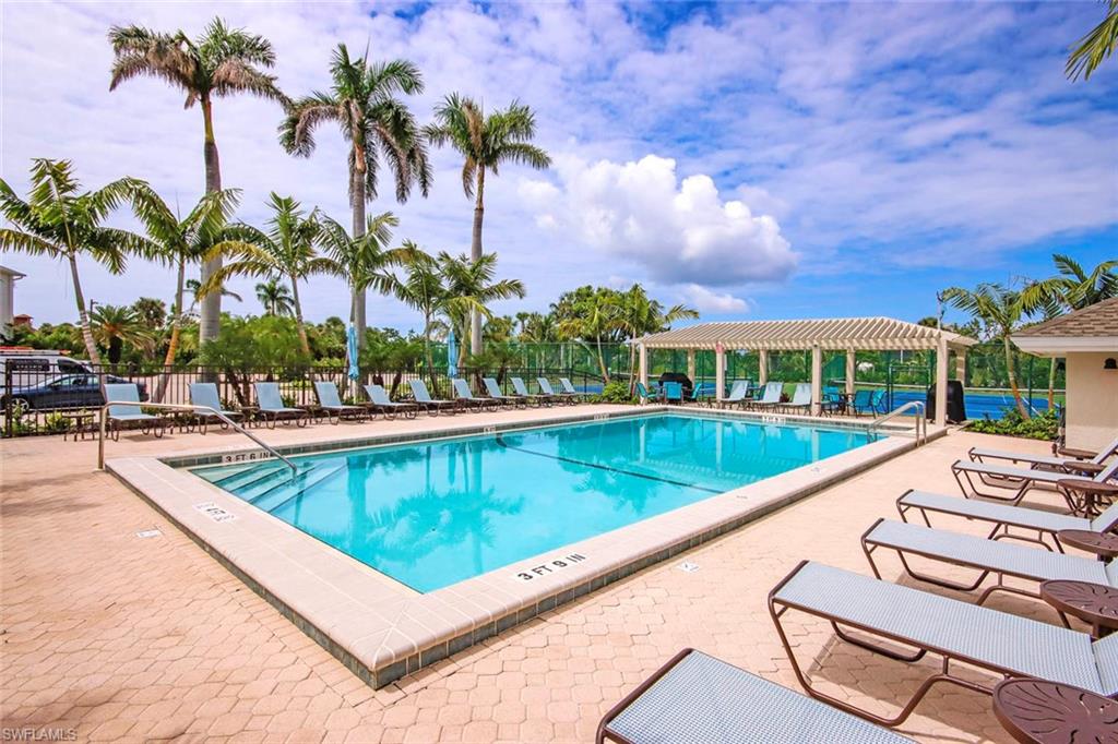 Community pool featuring a patio