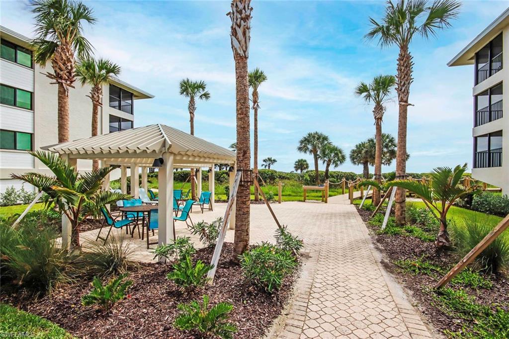 Surrounding community with a pergola and a patio area