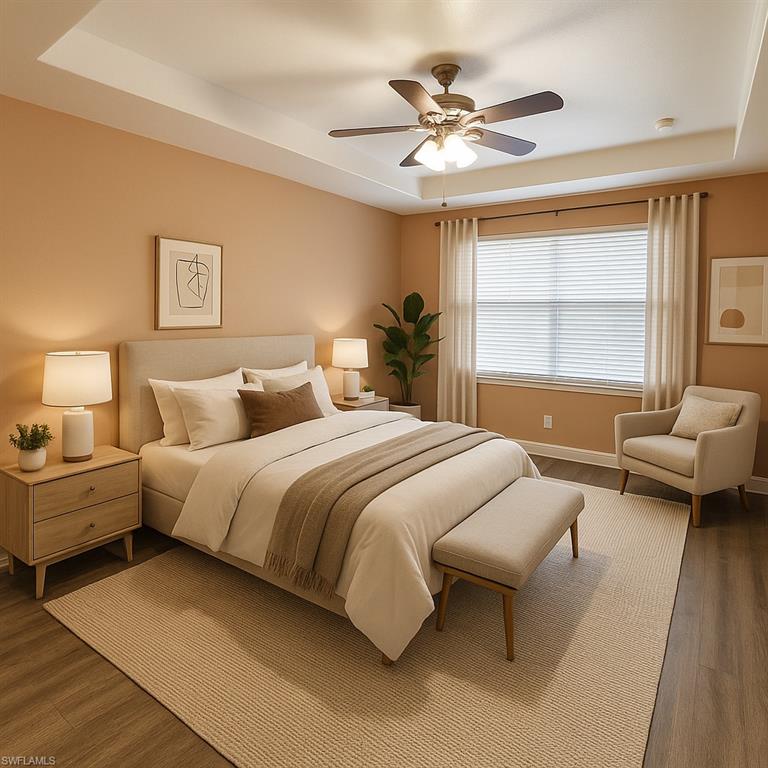 Virtually staged Bedroom with a tray ceiling and wood finished floors