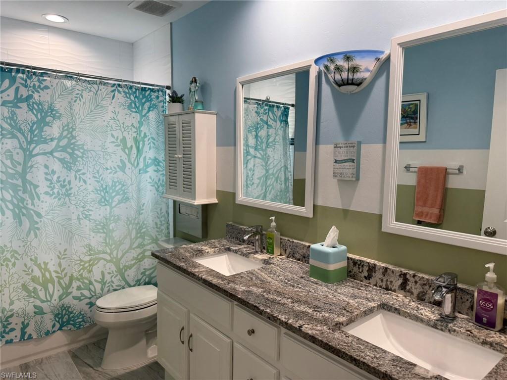 Guest Bathroom with Dual Sinks, Tub Shower Combination