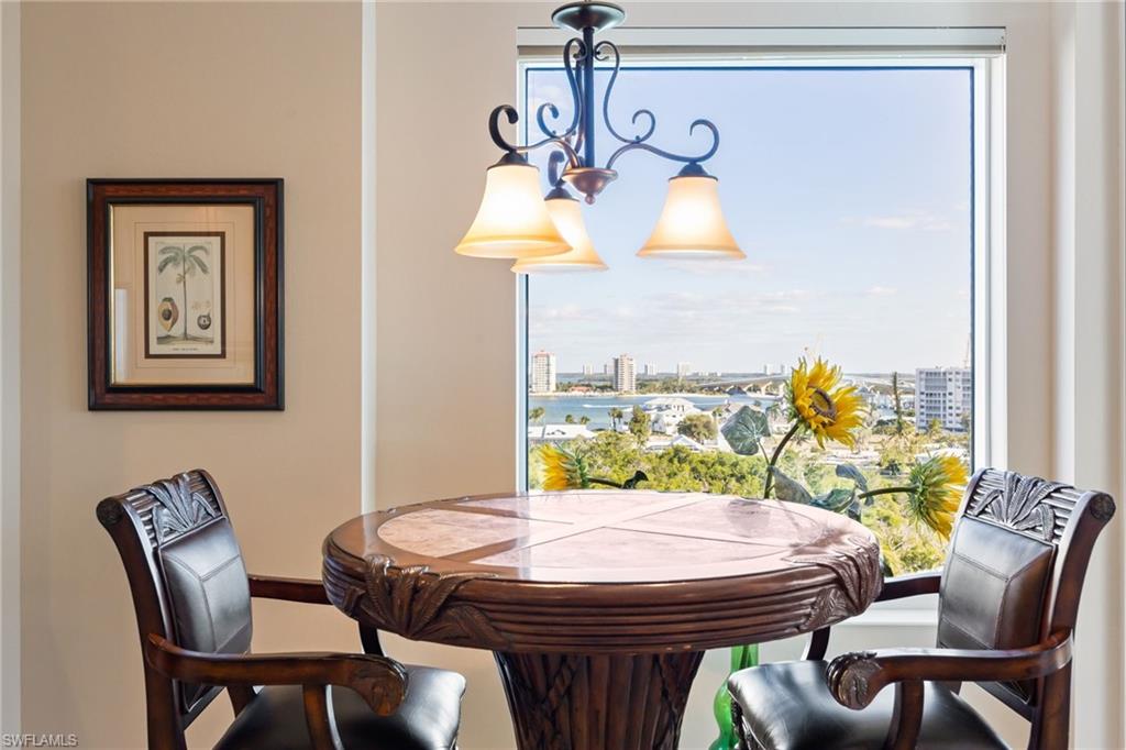 Dining space with a chandelier and baseboards