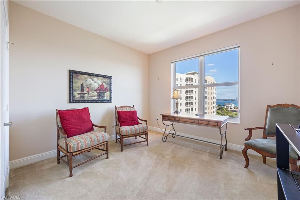 Sitting room featuring light colored carpet