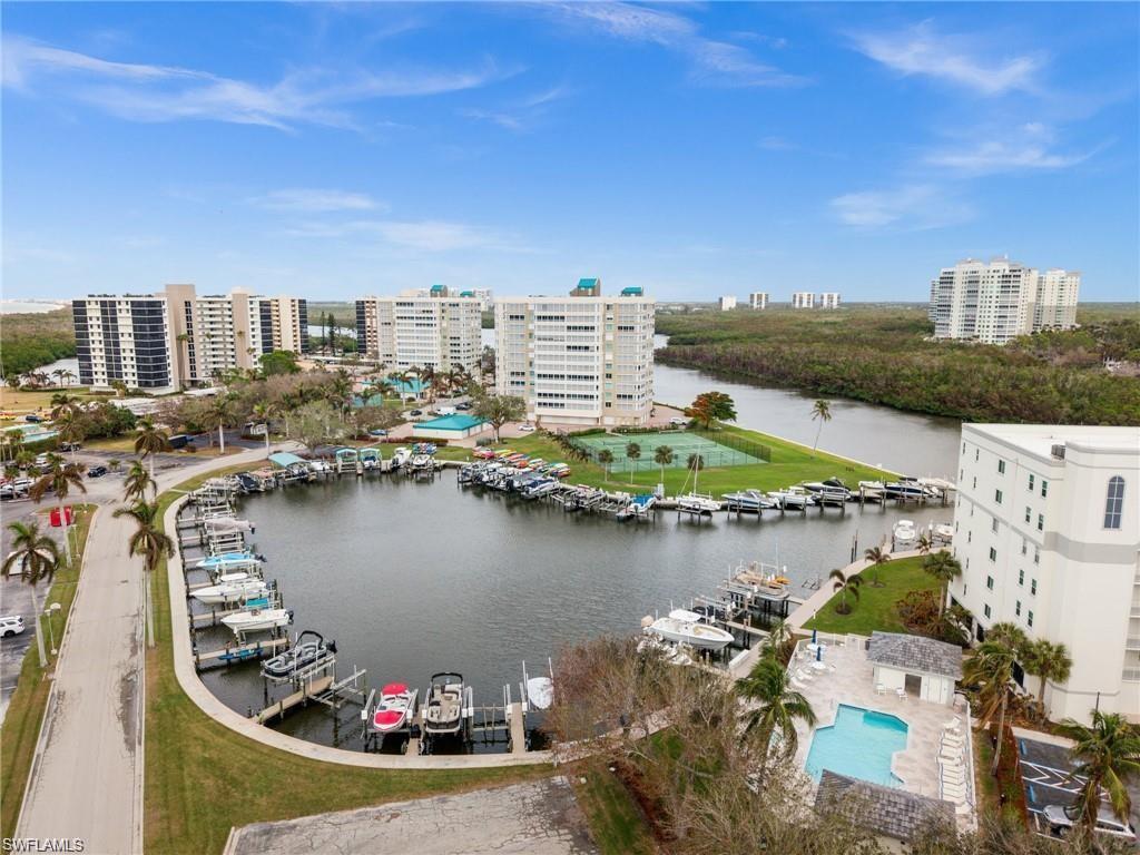 View of urban area featuring a nearby body of water and a marina