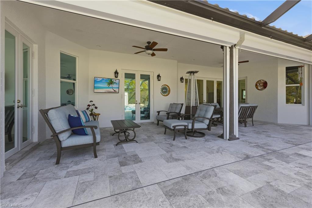 View of patio / terrace with french doors and ceiling fan