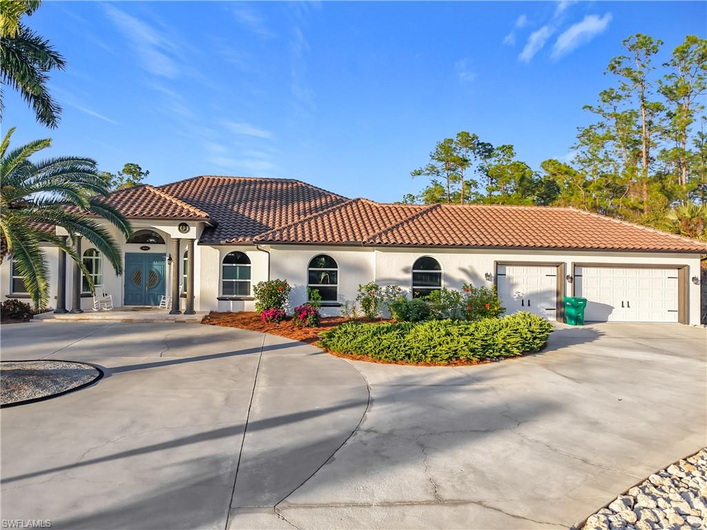 Mediterranean / spanish-style house featuring stucco siding, concrete driveway, and a tile roof