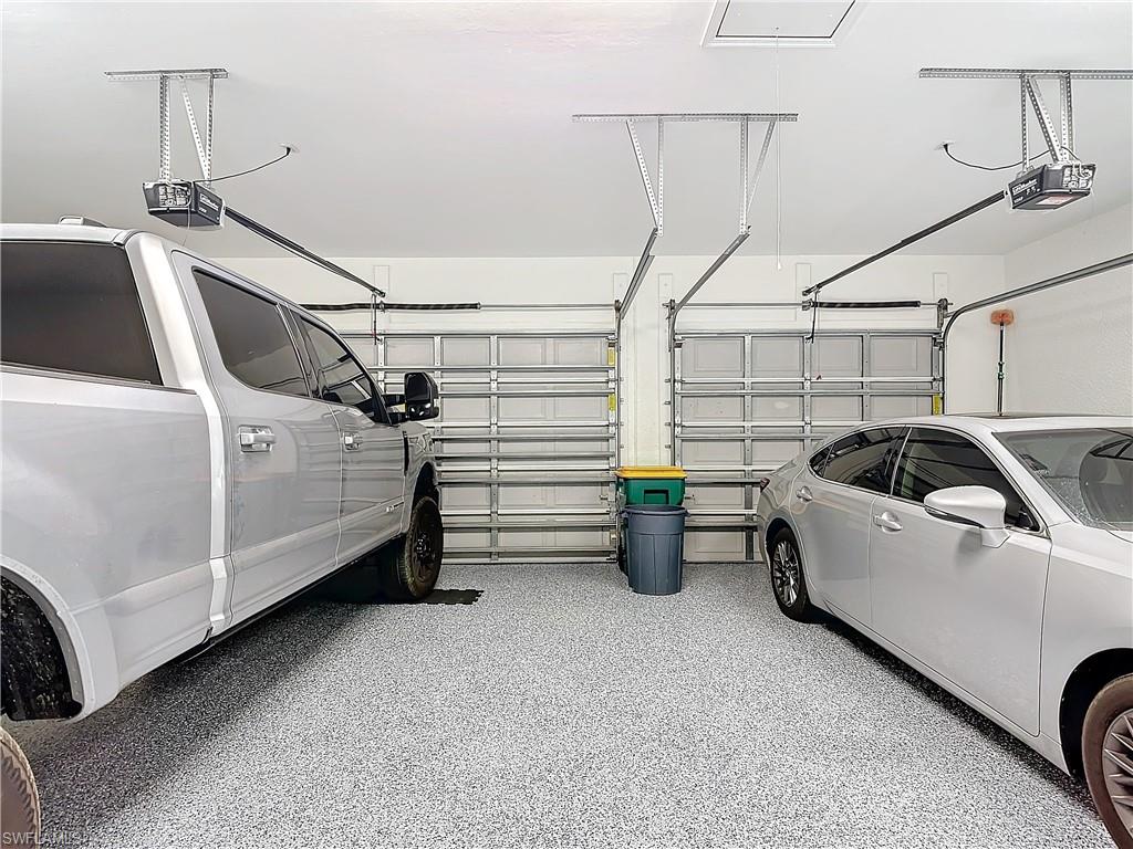 Garage featuring a garage door opener