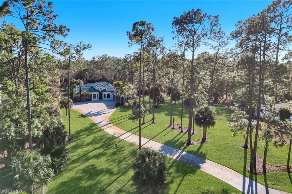 View of property's community with view of wooded area