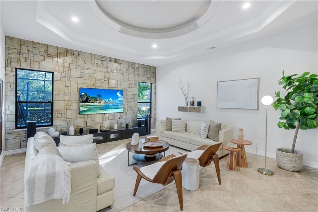 Living room with an accent wall and recessed lighting