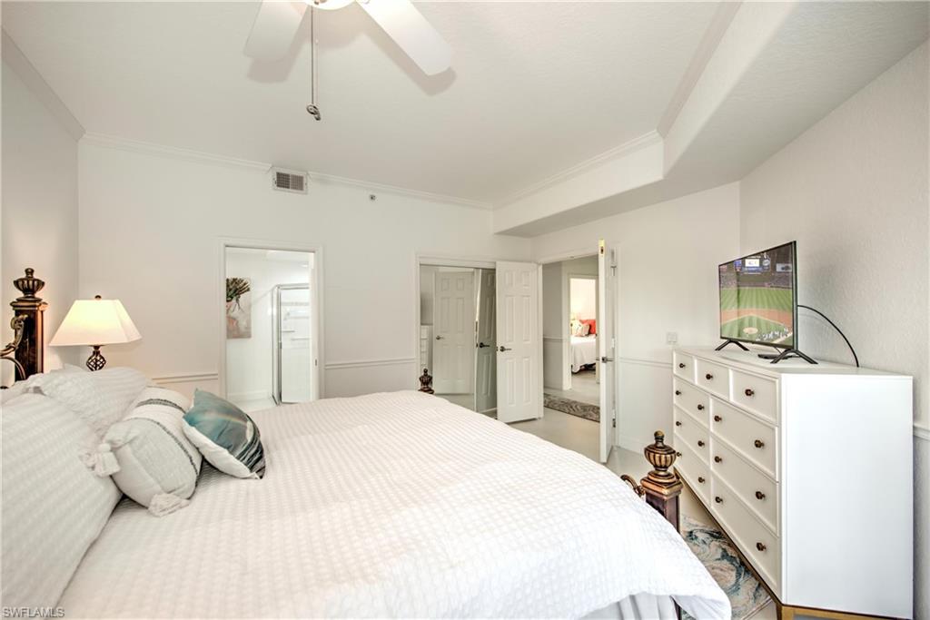 Bedroom featuring a ceiling fan and crown molding