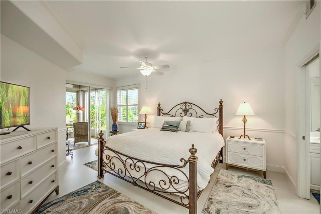 Bedroom featuring access to exterior, crown molding, and a ceiling fan