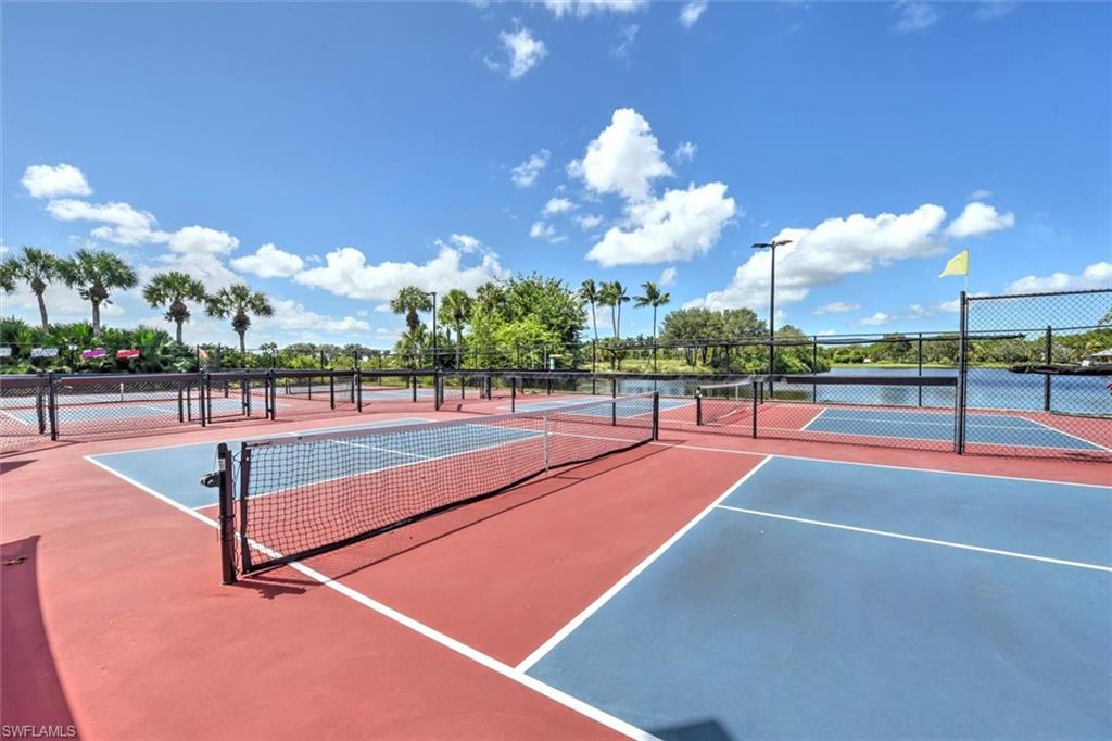 View of tennis court featuring community basketball court