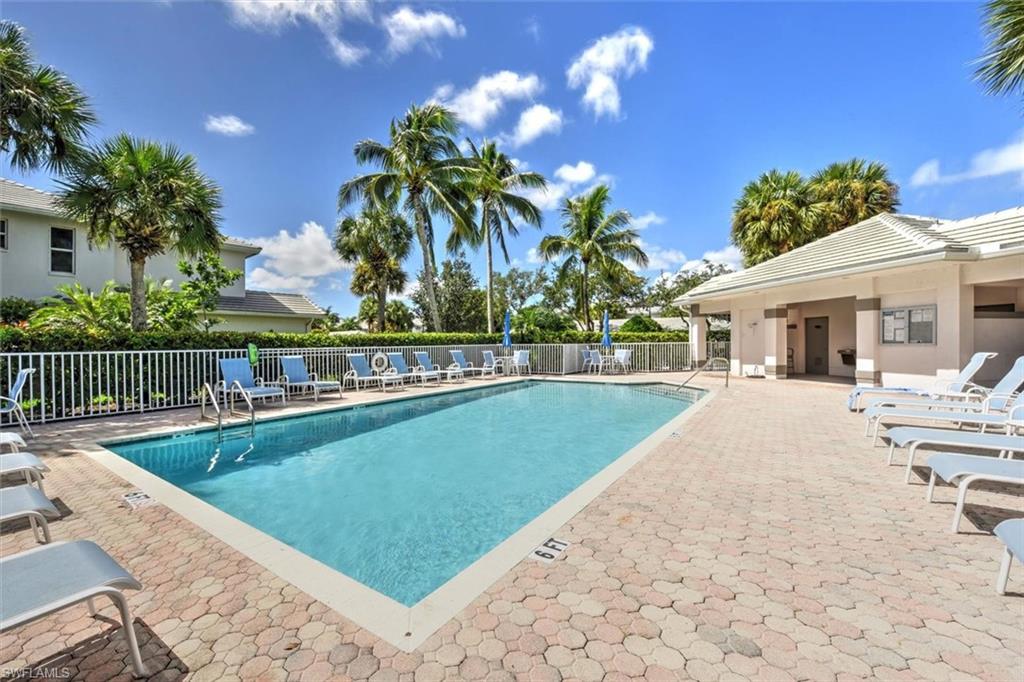 Community pool with a patio