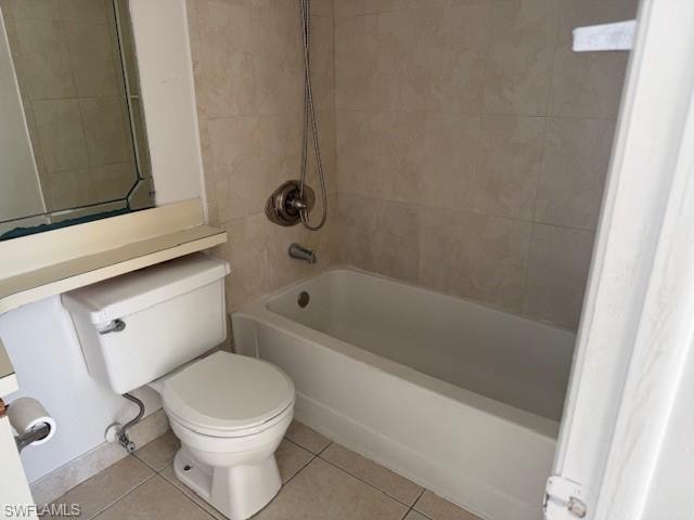 Full bathroom featuring shower / washtub combination and light tile patterned floors