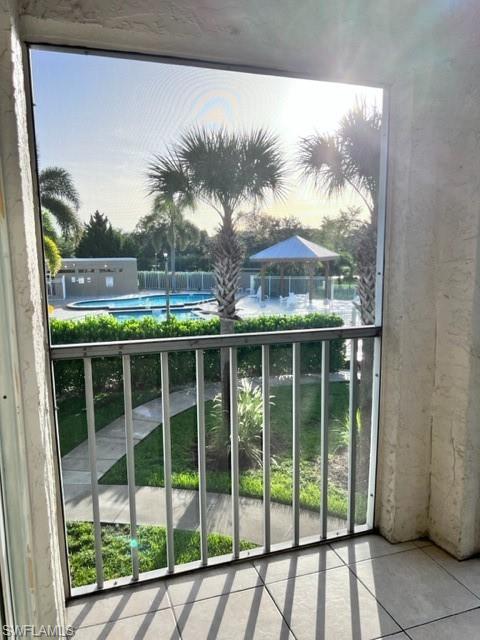 Balcony with view of pool area