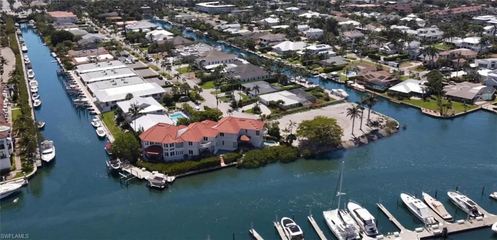 Aerial view Slip C-7 in Curlew Canal at The Naples Bay Resort, leading out to Naples Bay