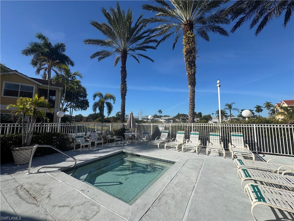 View of pool featuring a patio area and a hot tub