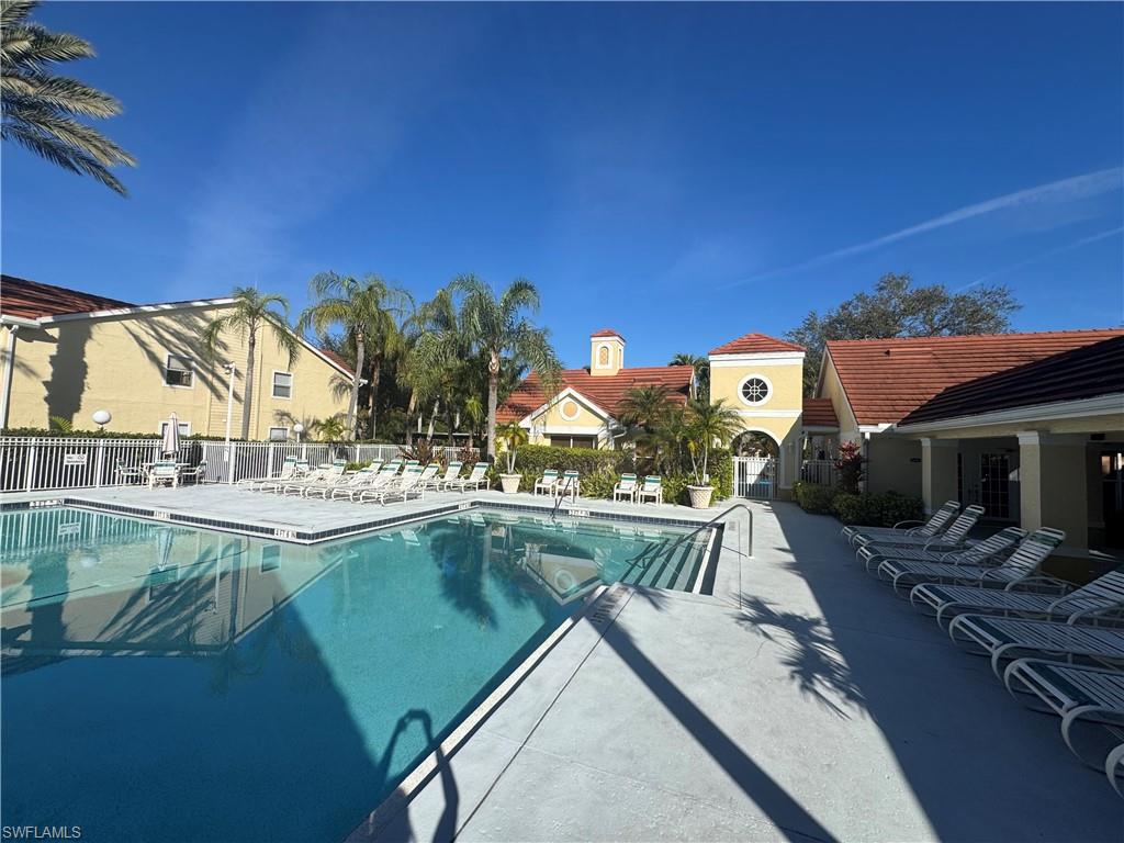 Community pool featuring a patio