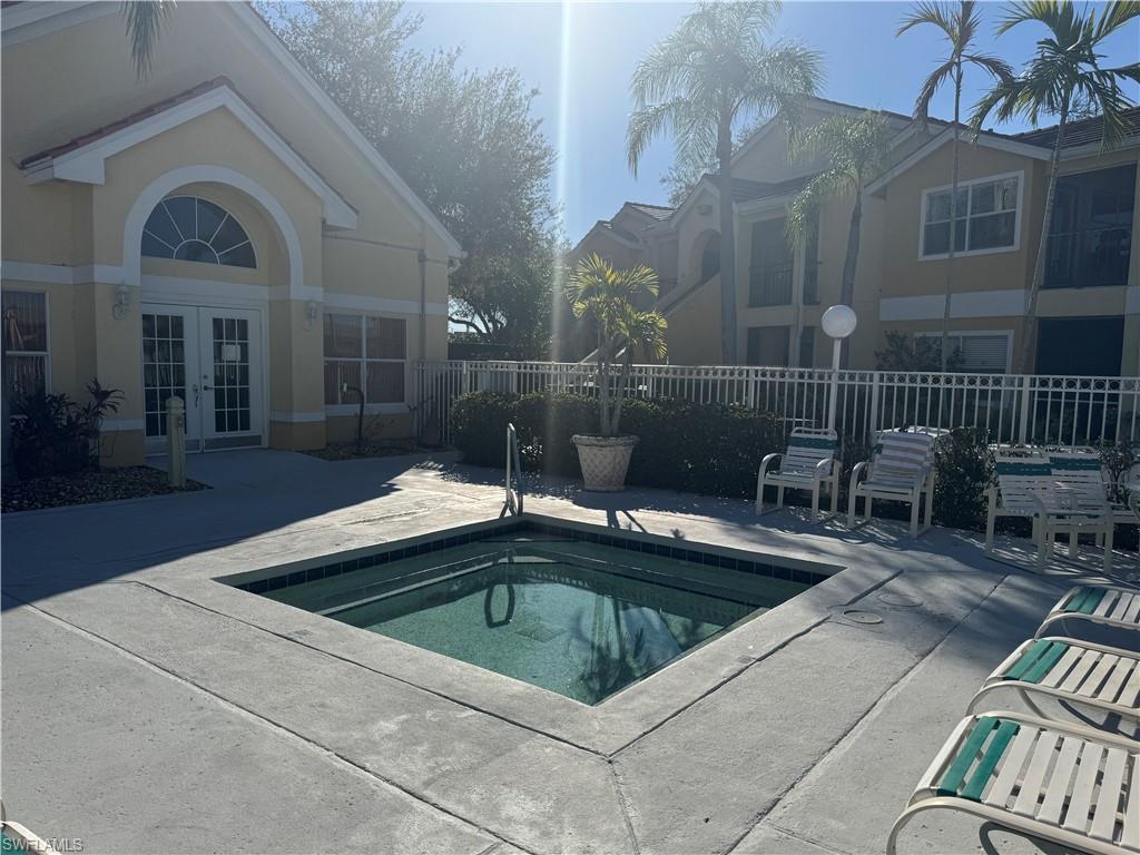 View of pool featuring french doors, a patio area, and a swimming pool