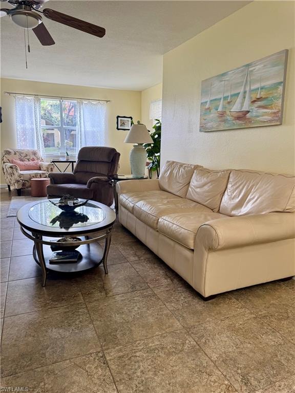Living area featuring a ceiling fan