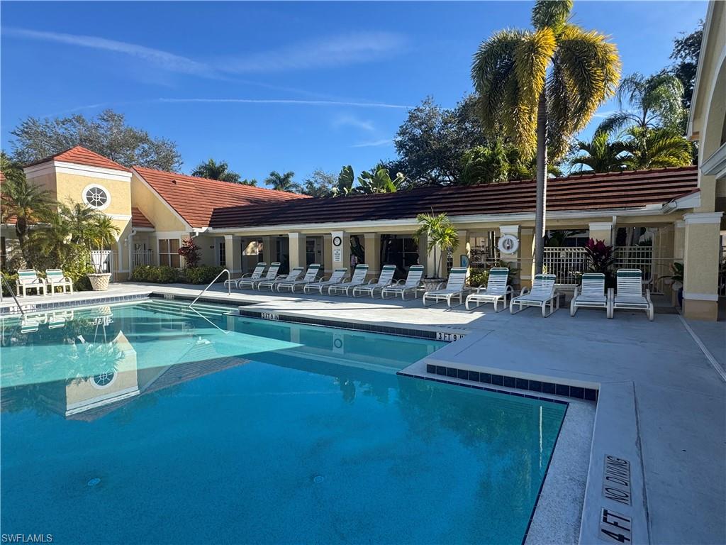 Community pool featuring a patio