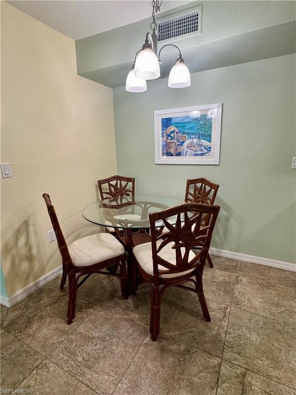Dining space featuring a textured wall