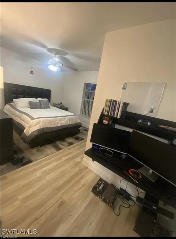 Bedroom featuring wood finished floors and ceiling fan