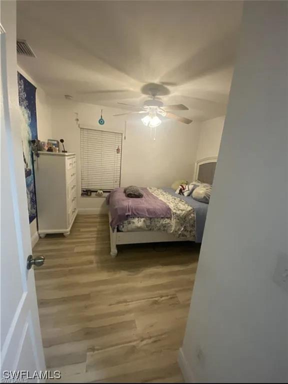 Bedroom featuring a ceiling fan and light wood finished floors