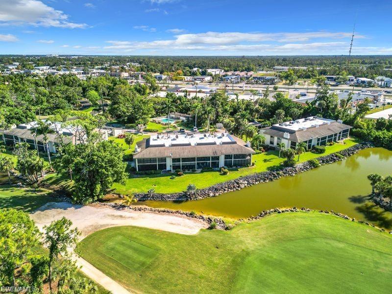 Drone / aerial view of a golf course and a large body of water